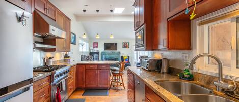 Fully equipped kitchen with Viking stove, new fridge, and everything you need