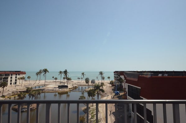 Roof top deck view of gulf and under constrution courtyard and pool