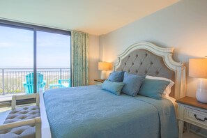 The master bedroom features ocean views, access to a private balcony and a king bed.