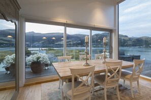 Spacious dining area with 180 degrees views and sliding doors to deck