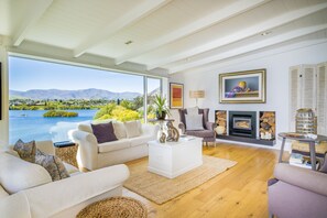 Beautifully furnished living room with roaring wood fire and central heating
