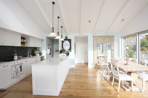 Beautiful kitchen and dining area - sliding doors open to the deck