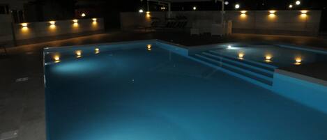 the pool lit up at night