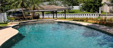 Resort style pool with canal view.