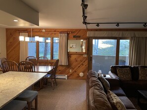 Sliding glass door in the living room opens up to a lovely shared yard