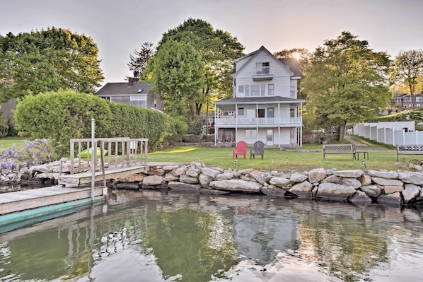 Stay in West Mystic at this vacation rental on Beebe Cove with a wraparound deck