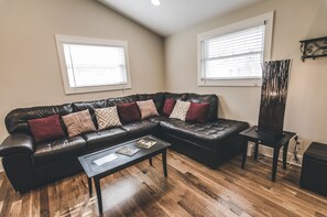 Living room with vaulted ceilings.