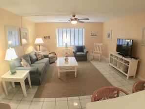 Living room with flat screen cable TV, Netflix and password protected wifi.