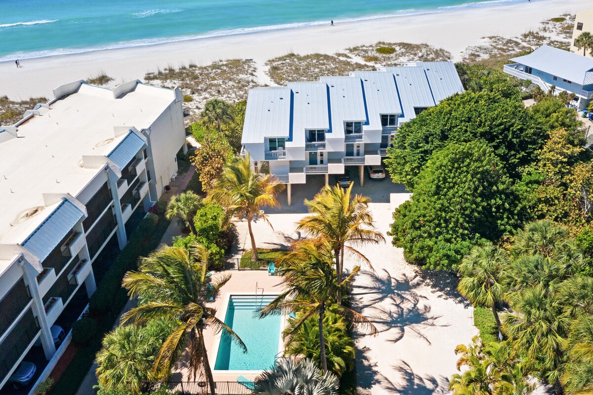 Beachfront condo with WiFi, two decks, Gulf views & pool – walk to the trolley