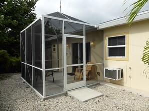 private, sreened porch at the back