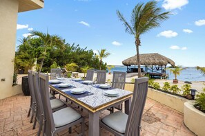 Indulge in the picturesque view that surrounds this villa, where turquoise waters meet golden sands, and palm trees sway gently in the tropical breeze, creating a scene straight out of a postcard.