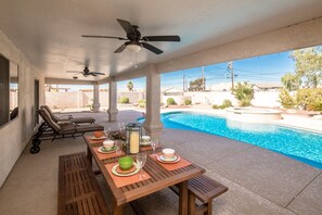 Plenty of outdoor furniture for dining and lounging at the pool.