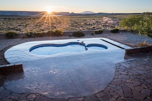 Heated swimming pool with seating area