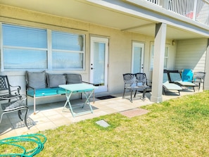 Patio on ground level with access from master bedroom and den area