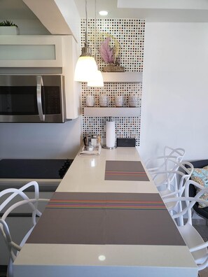 Quartz kitchen island for dining.