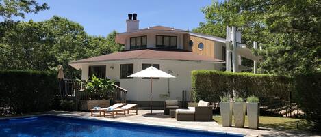 House and back yard. The pool gets plenty of sun throughout the day.