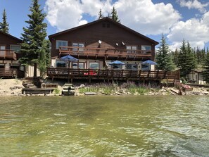 Lake view of deck.  Left half is the unit for rent