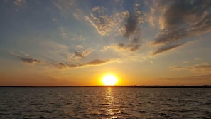 Enjoy amazing sunsets right over Sailboat Bridge.  Make your own postcard!