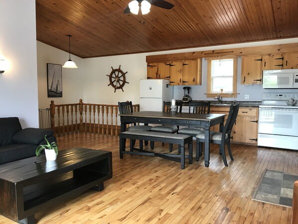 Open-concept living area, dining and kitchen.