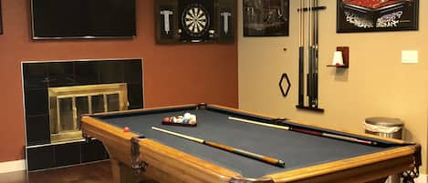 Entertainment Room—pool table TV dart and relaxing sofa bed. 