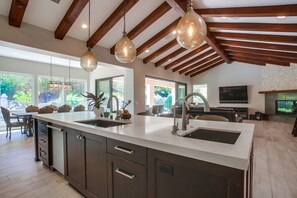 Beautiful Vaulted Ceilings Covering the Open Concept Kitchen, Dining, Living Rm