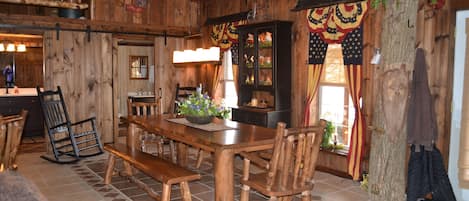 Dining Room featuring new aspen log furniture and heated floors