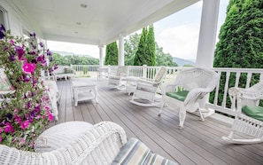 The covered porch is great for evening talks or morning coffee