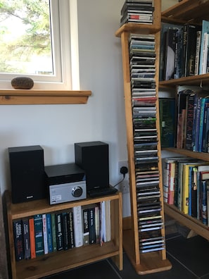 Music system with bluetooth, a varied collection of CDs and books