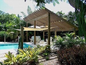 Covered pool patio, solar panels heat pool
