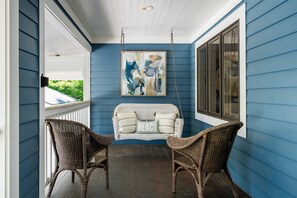 Escape to the front porch to enjoy your morning coffee or afternoon book read.