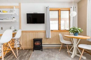 Cozy Electric Warmth: Relax by the glow of our electric fireplace, situated perfectly under the TV for those serene nights in. 