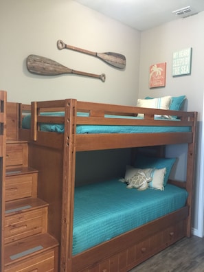 Bunk beds with easy access through build in steps with storage