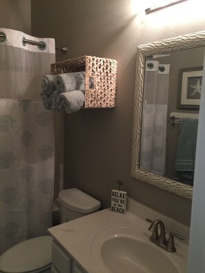 Bathroom with shower and bathtub combo