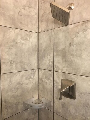 Tile shower with frameless glass