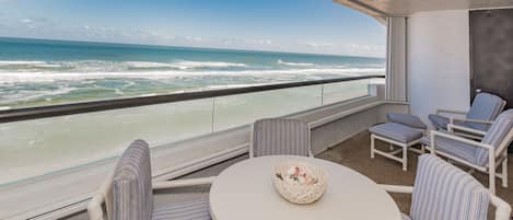 Oceanside private, oceanfront balcony of this New Smyrna Beach rental with balcony furniture.
