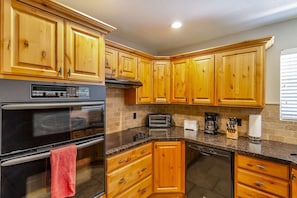 Stay in and cook your meals. You will enjoy this kitchen