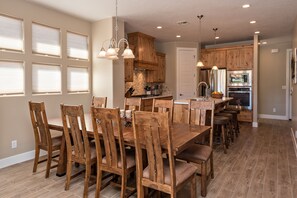 Dining Table - Spacious dining table seats 8 or add the bench from the entry way and there&#39;s room for 12. Bar stools provide additional seating.