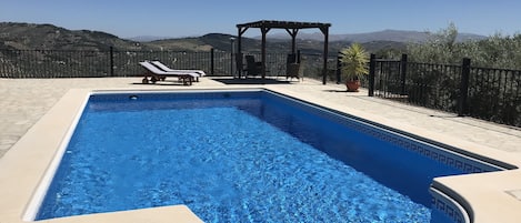 Large private pool terrace area, far reaching views over  rolling olive groves. 