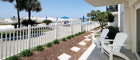 Private Patio with views of Swimming Pool & Beach Access