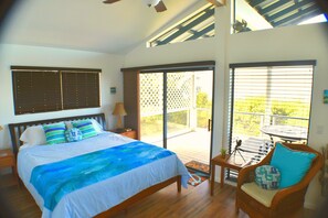 Master bedroom Cal. King bed, 40" Smart TV, vaulted ceiling and fan.