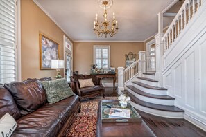 Comfortable Living Room with staircase to the second floor