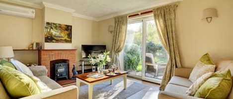 Sitting Room with comfortable seating and door to garden