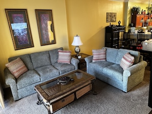 Living room with queen pull out sofa with upgraded foam mattress