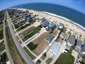 Cottage in foreground. Fishhead's and Outer Banks Pier in the background