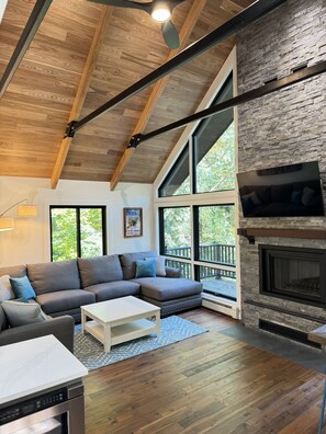Relax by the fire with views of your private wooded backyard