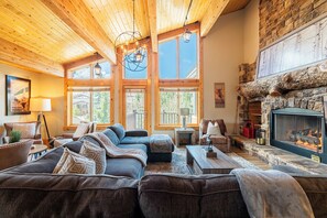 Mountain contemporary furnishings, 60" JVC TV with cable, and a gas-assist fireplace