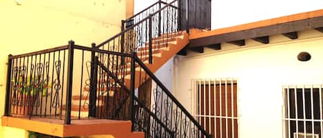 .View wide stairs leading to Apt 3