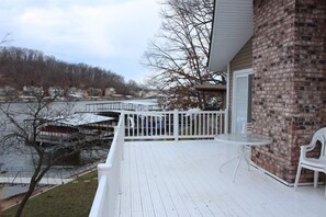 Upstairs deck connected to two bedrooms.