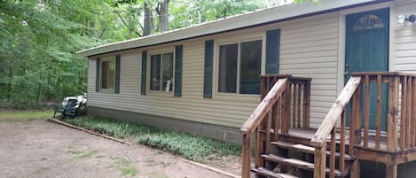 Front of cottage;  Shady, sandy and private.