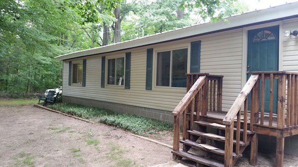 Front of cottage;  Shady, sandy and private.